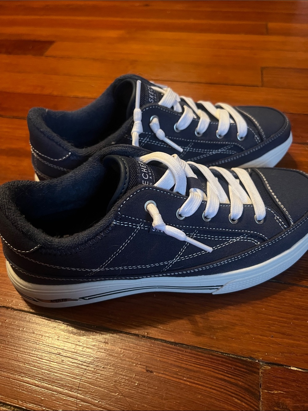 Skechers women Navy Canvas Sneakers with White Laces